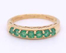 Fantastic Yellow Gold Emerald Shared Prong Band