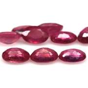 Vibrant 9.33ct oval cut reddish pink Ruby set