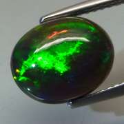 Magnificent 2.56ct floral flashing Black Opal