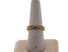 Solitaire Diamond Ring with Round side stones and a 14k Gold Band