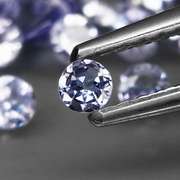 Heavy flashing 4.77ct diamond cut Tanzanite set