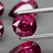 Mixed cut 9.46ct premium cherry pink Rhodolite Garnet set