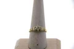 Oval Diamond Ring beset by Baguette Diamonds on a 14k Gold Band