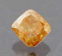 Stunning .27ct cushion cut red orange Diamond