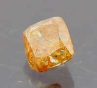 Stunning .27ct cushion cut red orange Diamond