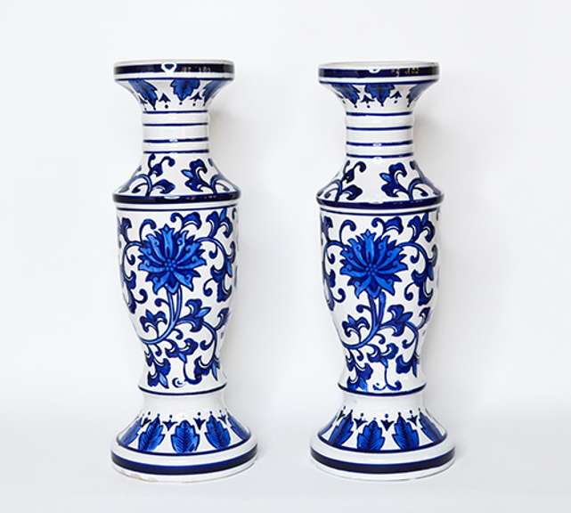 Two Large Cobalt Blue and White Chinoiserie Ceramic Candle Holders With Floral Design