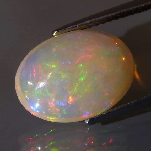 Glowing! 3.85ct full rainbow mixed patterned Jelly Opal
