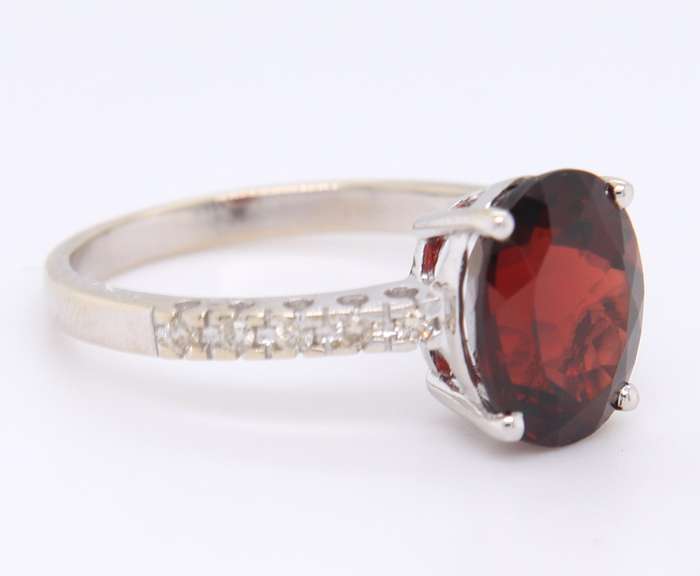 Dazzling White Gold Diamond and Oval Garnet Ring