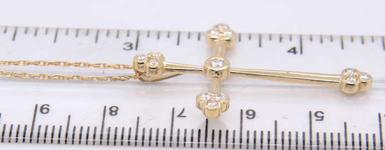 Attractive Yellow Gold Diamond Flared Edge Cross Pendant on Chain