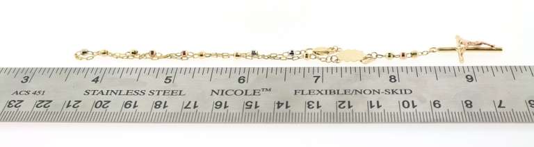 Fair14kt gold beaded bracelet with cross pendant