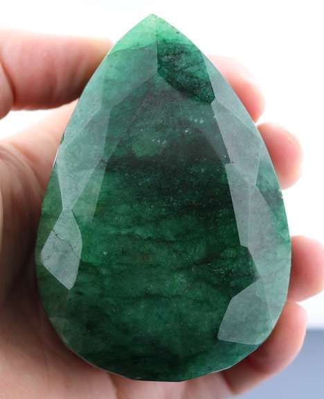 Huge .372kg (1860ct) pear cut forest green Emerald