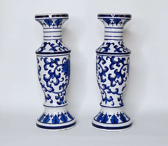 Two Large Cobalt Blue and White Chinoiserie Ceramic Candle Holders With Floral Design