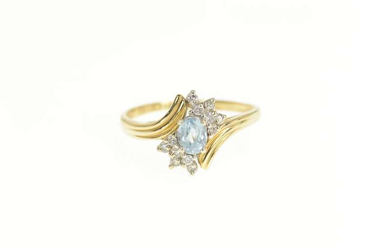 14K Yellow Gold Oval Blue Topaz Diamond Cluster Bypass Ring