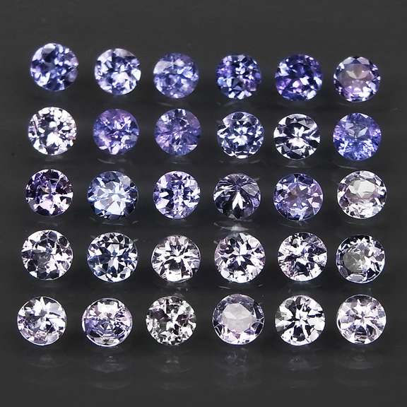 Glittering 5.11ct bright blue violet Tanzanite set