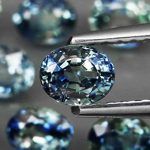 Heated only! 3.14ct blue green sapphire set