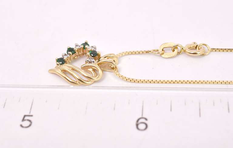 Elegant Emerald and Diamond Heart Pendant in 14K Yellow Gold