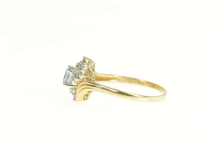 14K Yellow Gold Oval Blue Topaz Diamond Cluster Bypass Ring