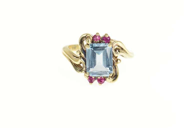 10K Yellow Gold Emerald Cut Blue Topaz Synthetic Ruby Bypass Ring