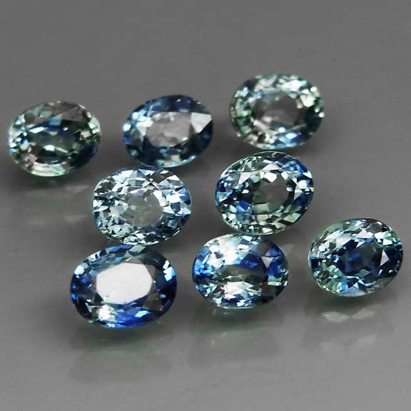 Heated only! 3.14ct blue green sapphire set