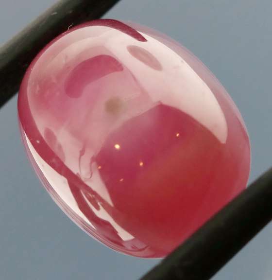 Shimmering 13.24ct top pinkish red Ruby cabochon