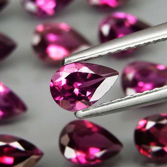 Ravishing 9.65ct violet pink Rhodolite Garnet set
