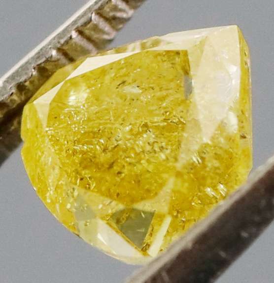 Rare .60ct pear cut canary yellow Diamond