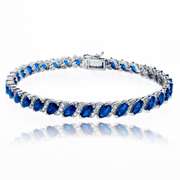 Created Blue Sapphire Tennis Bracelet with White Topaz Accents in 925 Silver