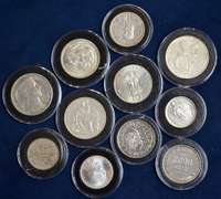 Lot Of 11 World Silver Coins In Plastic Cases.