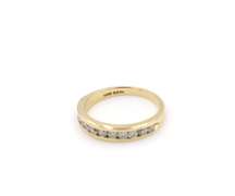 Elegant Yellow Gold Channel Diamond Band
