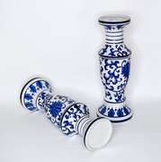 Two Large Cobalt Blue and White Chinoiserie Ceramic Candle Holders With Floral Design