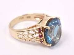 Luxurious London Blue Topaz and Ruby Ring in 14K Yellow Gold