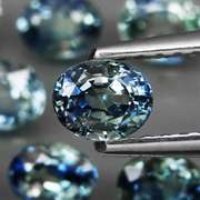 Heated only! 3.14ct blue green sapphire set
