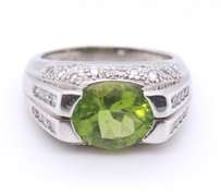 Charming White Gold oval Peridot and Diamond Ring