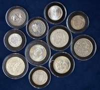 Lot Of 11 World Silver Coins In Plastic Cases.