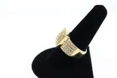 Regal 14k Yellow Gold Ring with Stepped Diamonds and Flanked by Baguette Diamonds
