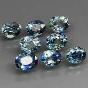 Heated only! 3.14ct blue green sapphire set