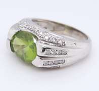 Charming White Gold oval Peridot and Diamond Ring