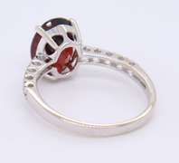 Dazzling White Gold Diamond and Oval Garnet Ring