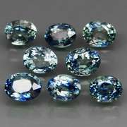 Heated only! 3.14ct blue green sapphire set