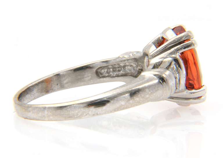 Fancy White Gold oval Orange Garnet and Baguette Diamond Ring
