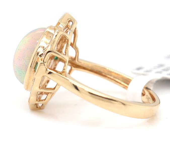 Incredible Yellow Gold opal Emerald and Diamond Frame Ring