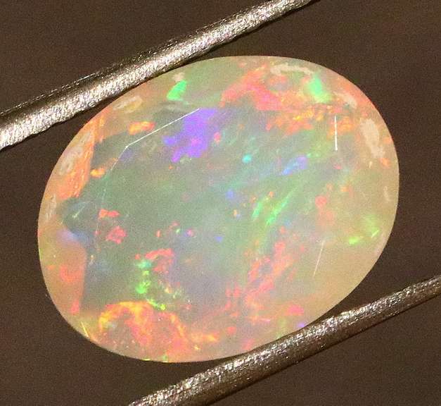 Wonderful glittering 2.05ct faceted Jelly Opal