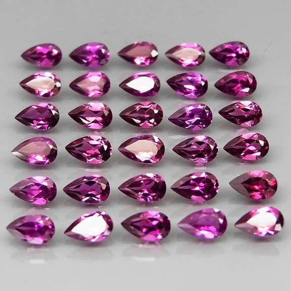 Ravishing 7.55ct violet pink Rhodolite Garnet set