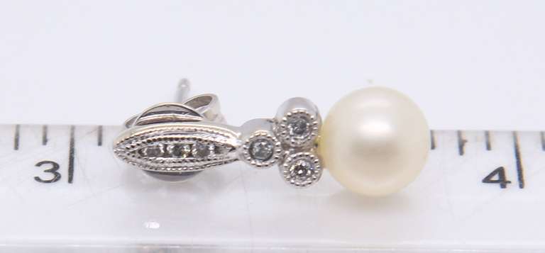 Elegant White Gold Pearl and Bezel Set Diamond Earrings