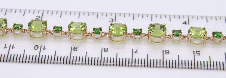 Powerful Yellow Gold Peridot and Tsavorite Bracelet