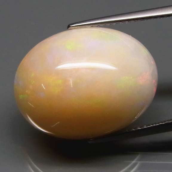 Smoldering flashing 12.07ct bi-colored Opal