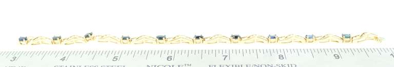 LADIES 14 KT YELLOW GOLD DIAMOND AND SAPPHIRE BRACELET.