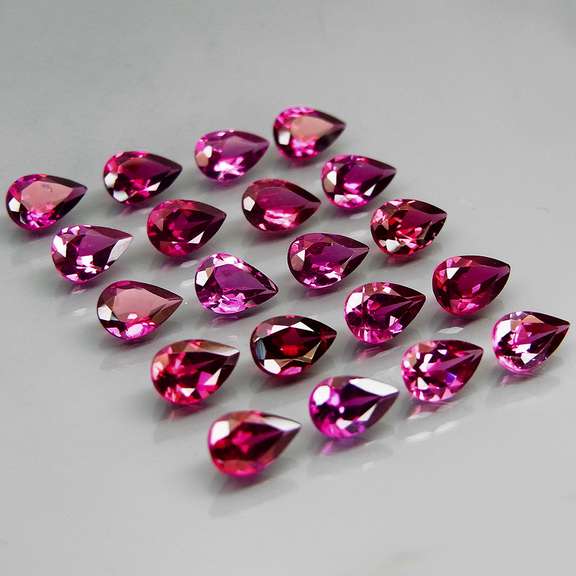 Premium pear cut 9.49ct VS Rhodolite Garnet set