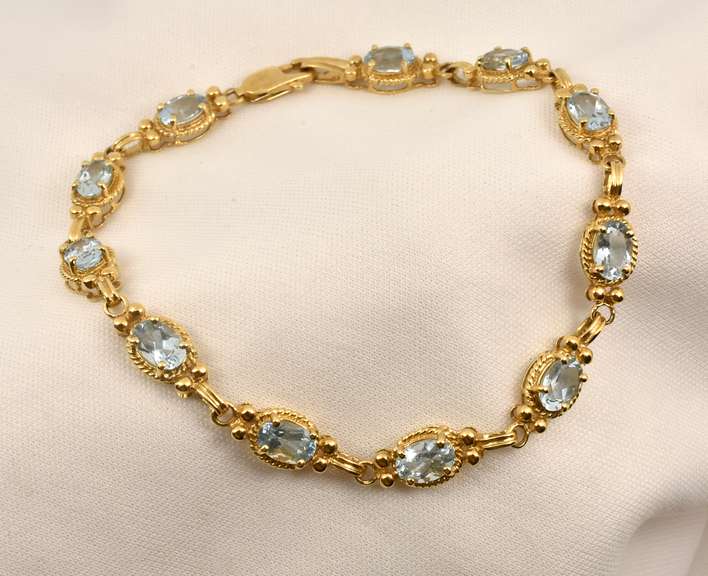 Fashionable Gold & Blue Topaz Bracelet
