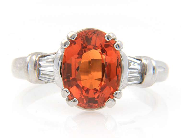 Fancy White Gold oval Orange Garnet and Baguette Diamond Ring